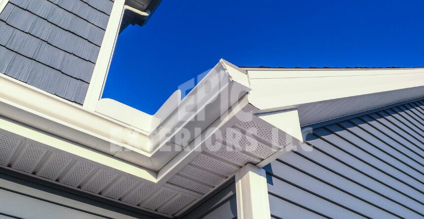 blue siding with white gutters